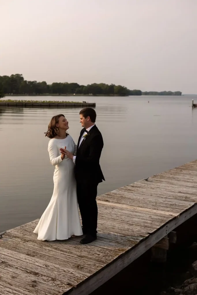 bride and groom on lake