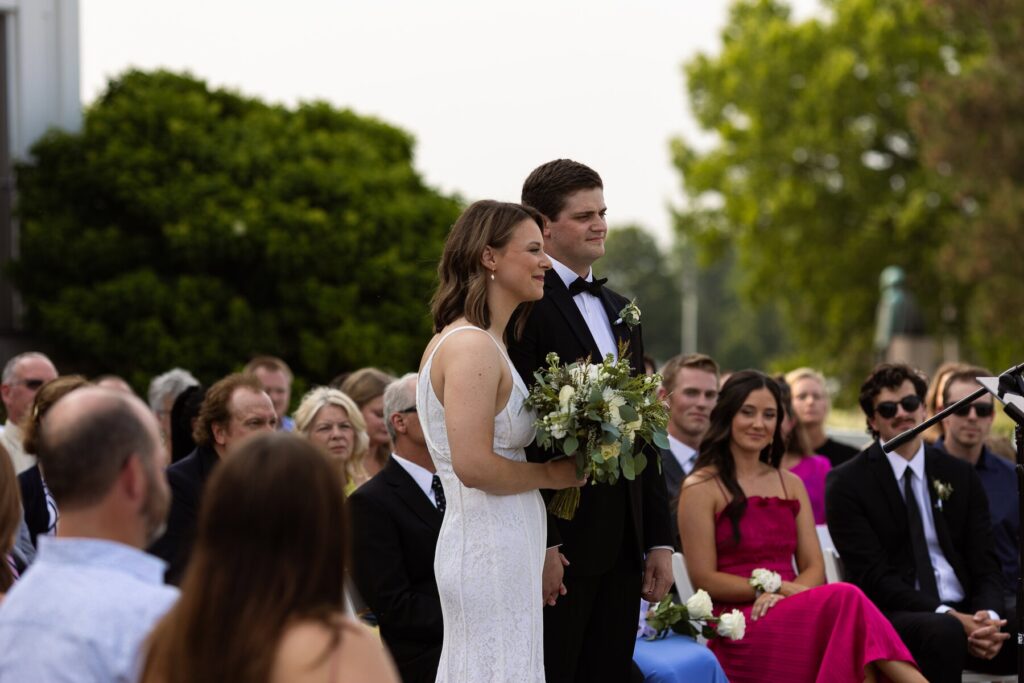 vow renewal couple surrounded by family and friends