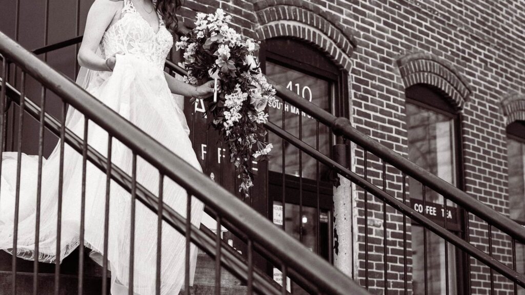 stillwater minnesota bride coming downstairs Lora Hotel wedding