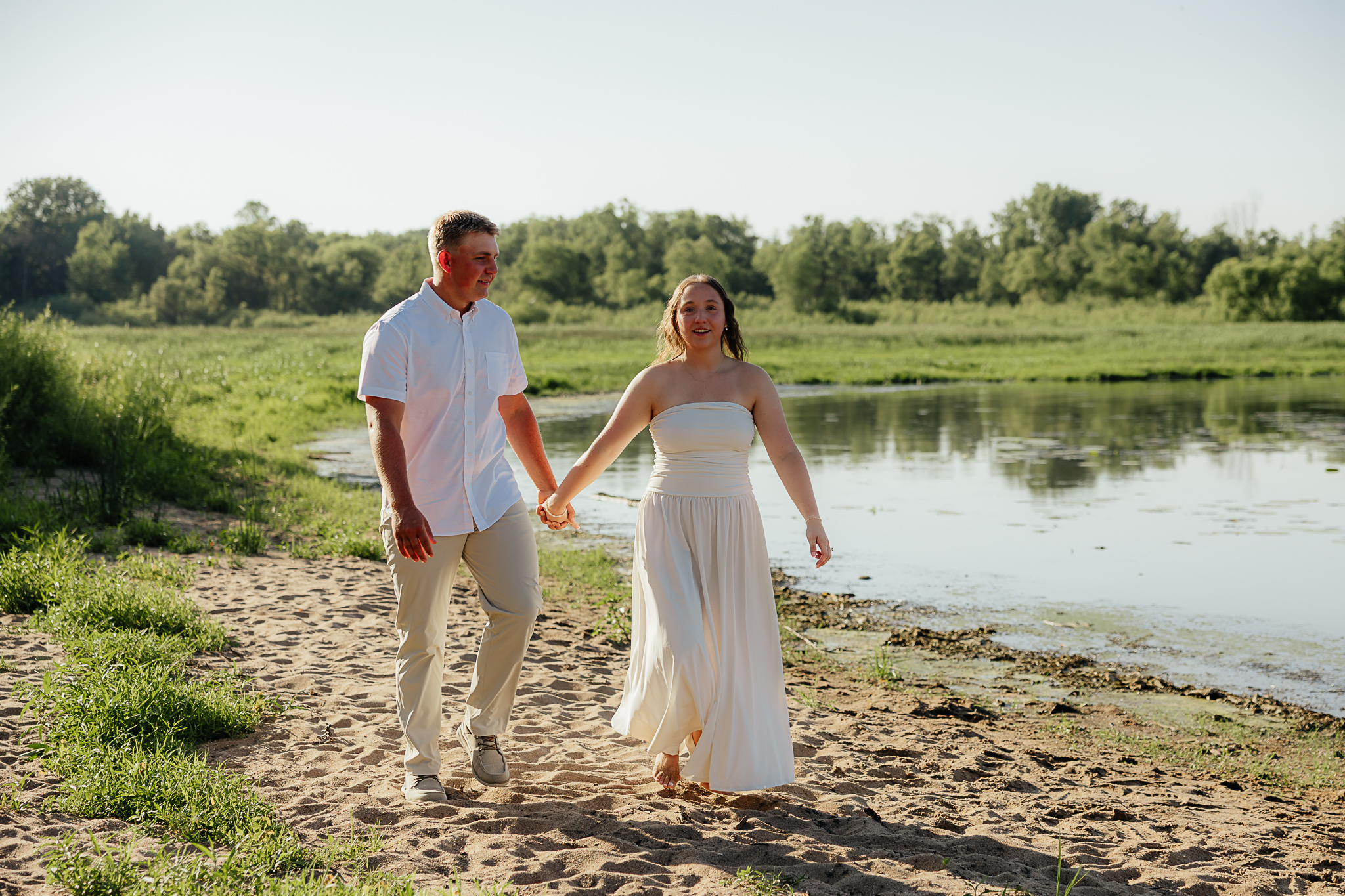 couple on the beach of lake pepin engagement session